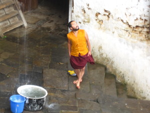 One of the monks excited for the rain at Chari Monastery