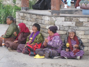 Local women enjoying talking and praying at the National Memorial Choten 