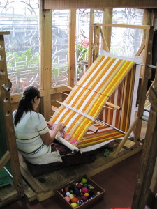 One of the master weavers on the loom