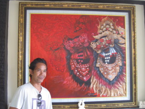 Ketut and his masterpiece. This is his signature painting style