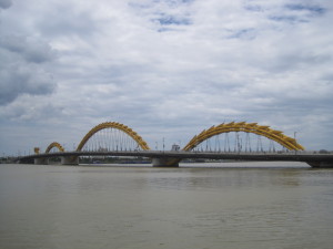 Dragon Bridge during day showing the gold