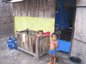 Local girl in a crib I kept walking by.  That crib has gotten some good use!