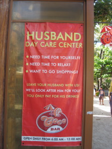 Great sign by a bar - drop your husband off to drink and the ladies go for a massage or shopping!